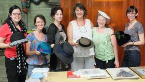 The millinery class with their completed buckram hats.